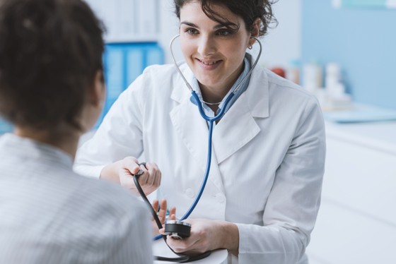 Doctor measuring blood pressure